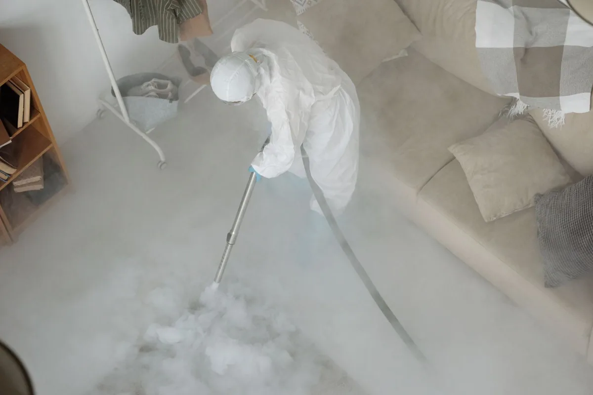 Biohazard cleanup technician in protective equipment, Enumclaw, WA